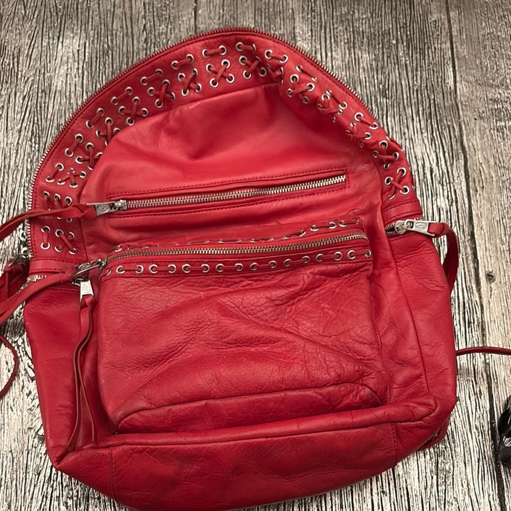 ASH Red Leather Backpack with Silver Accents. 
100% genuine letter great shape.